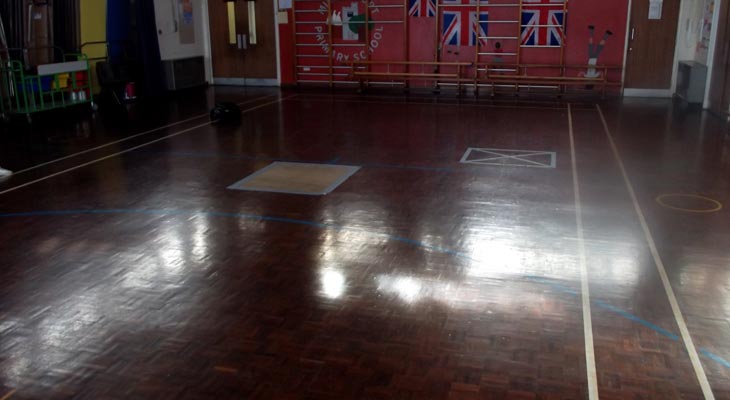 Dark school sports hall flooring.